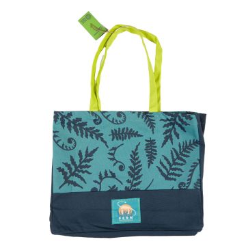 The teal Fern Tote Bag showing its lime-coloured straps, dark-teal fern-leaf pattern and Fern the Diplodocus logo.