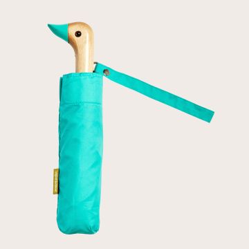 The mint-green Duckhead Umbrella shown rolled up in its sleeve with the duckhead handle and carry strap at the top.