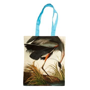 The Great Blue Heron Audubon Tote Bag showing the illustration of the bird bending its long neck to the water's edge, with sky-blue handles.
